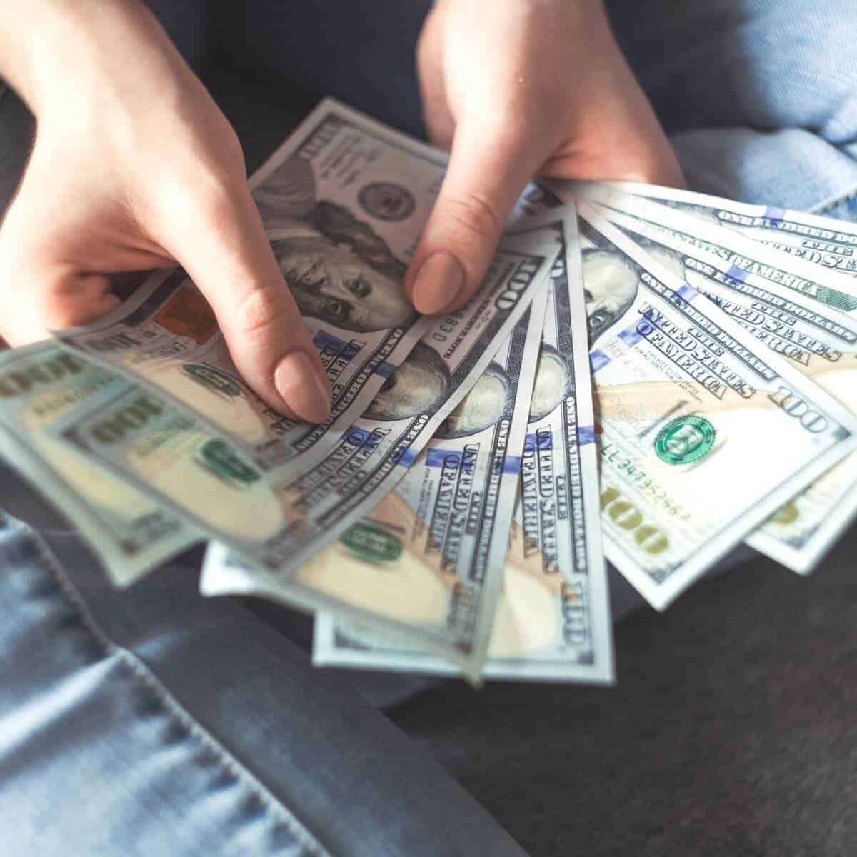 Close-up of a hand holding money.