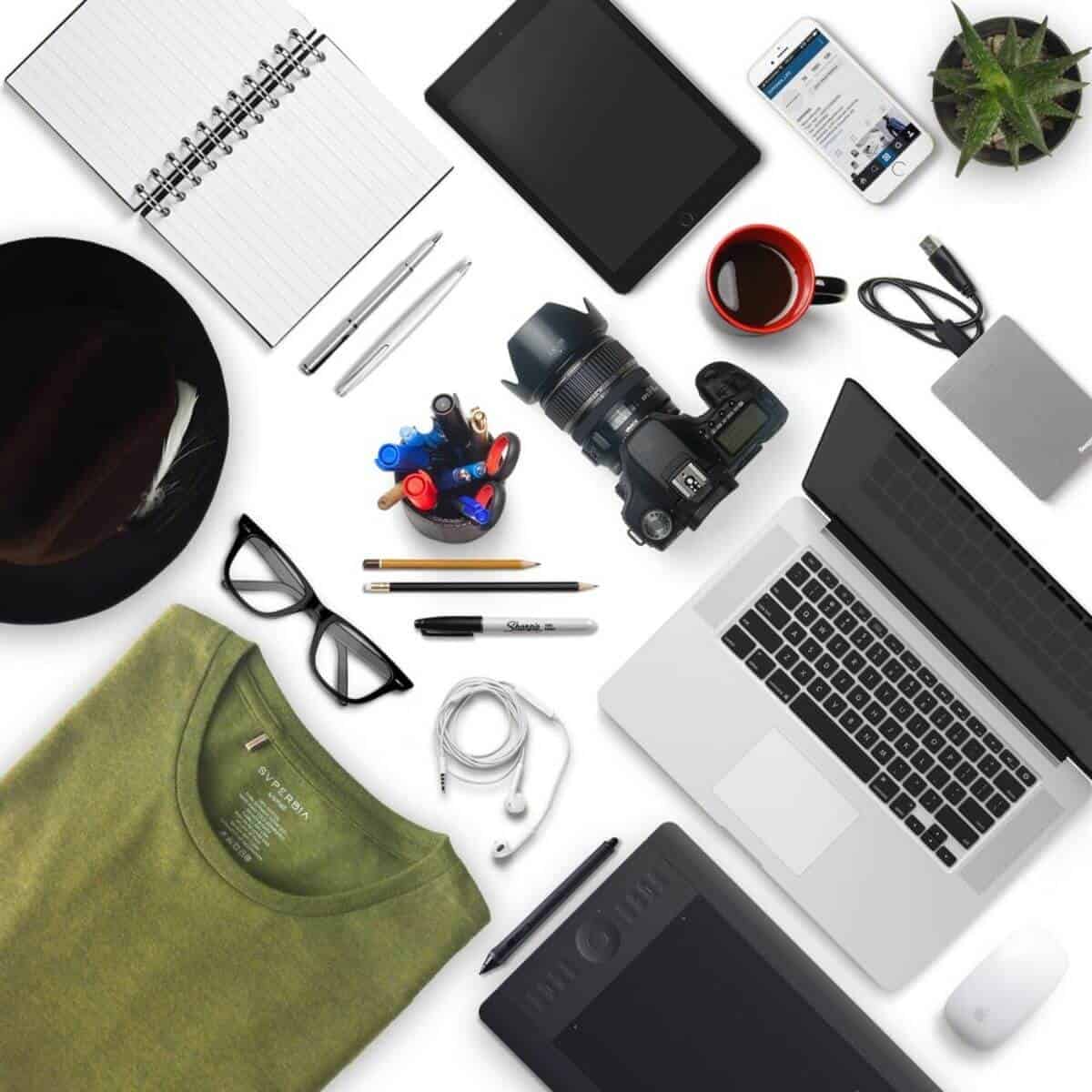 Flatlay of a photographers equipment and laptop.