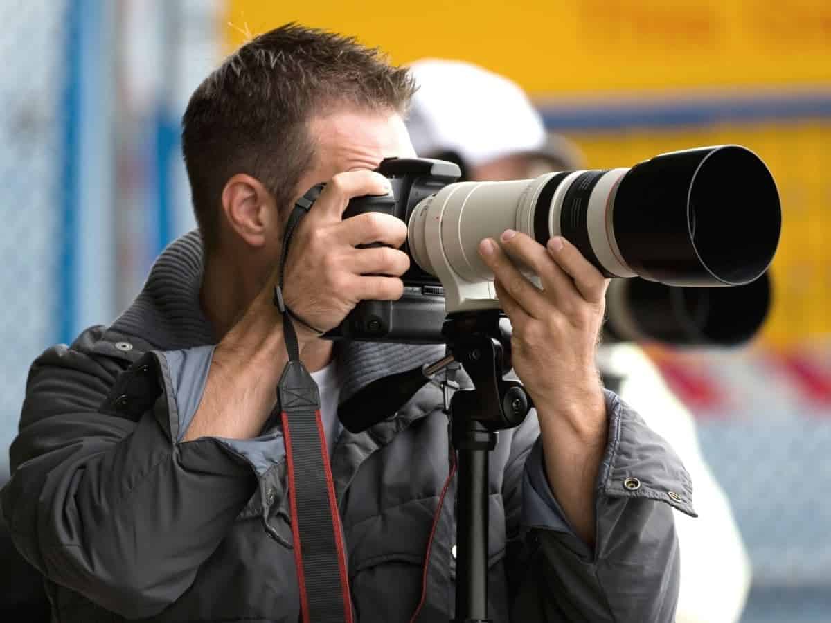 Photographer using a telephoto lens.