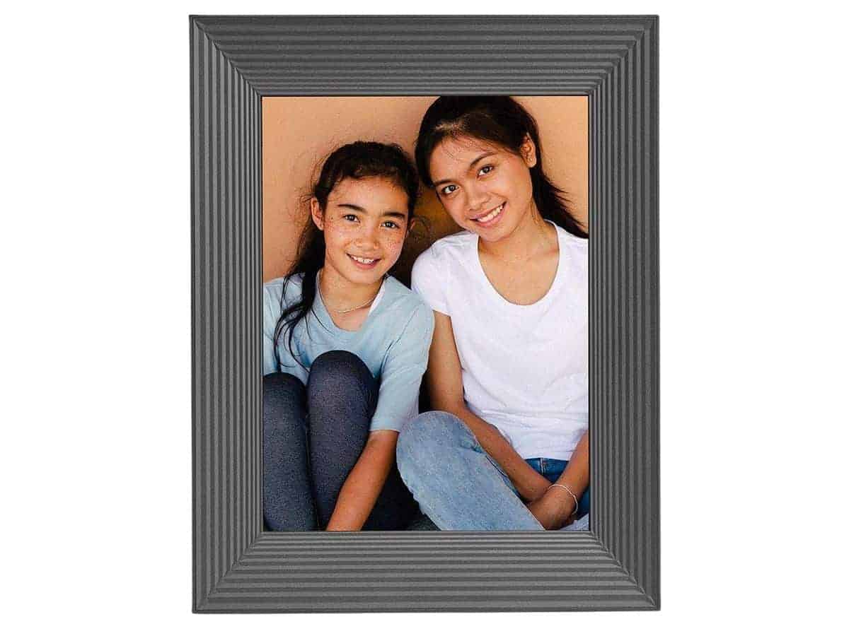 Photo of two girls on an Aura digital picture frame.