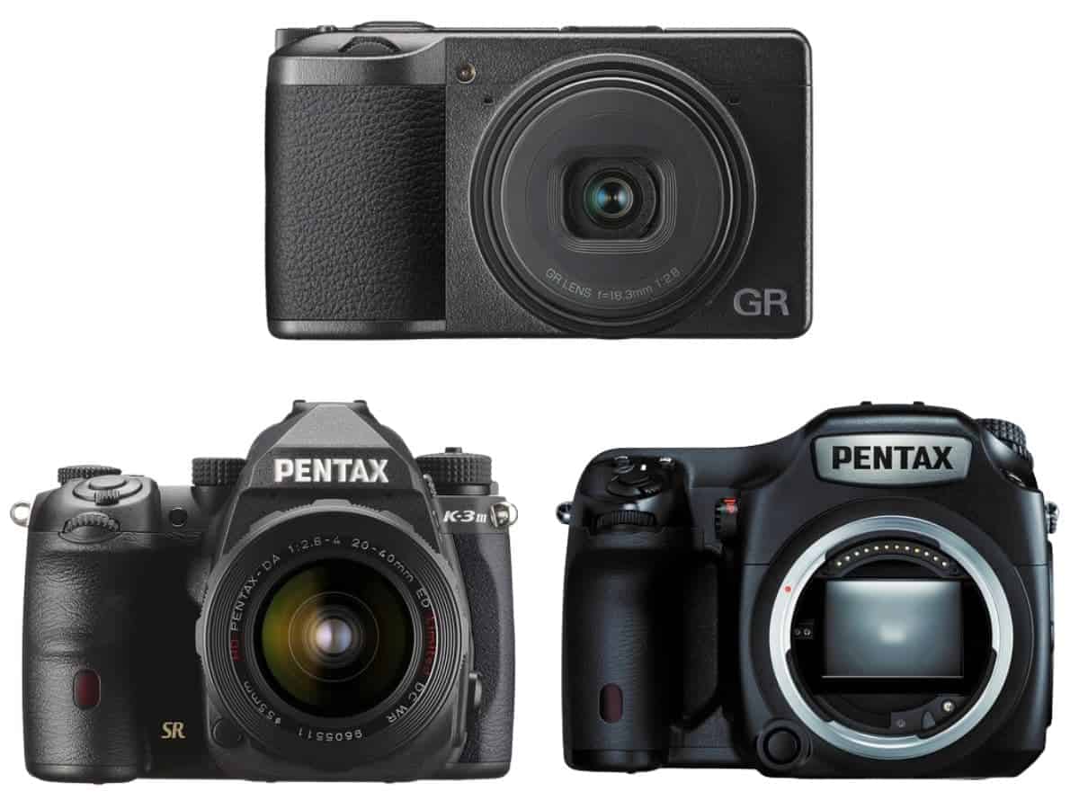 Three Ricoh Pentax cameras.