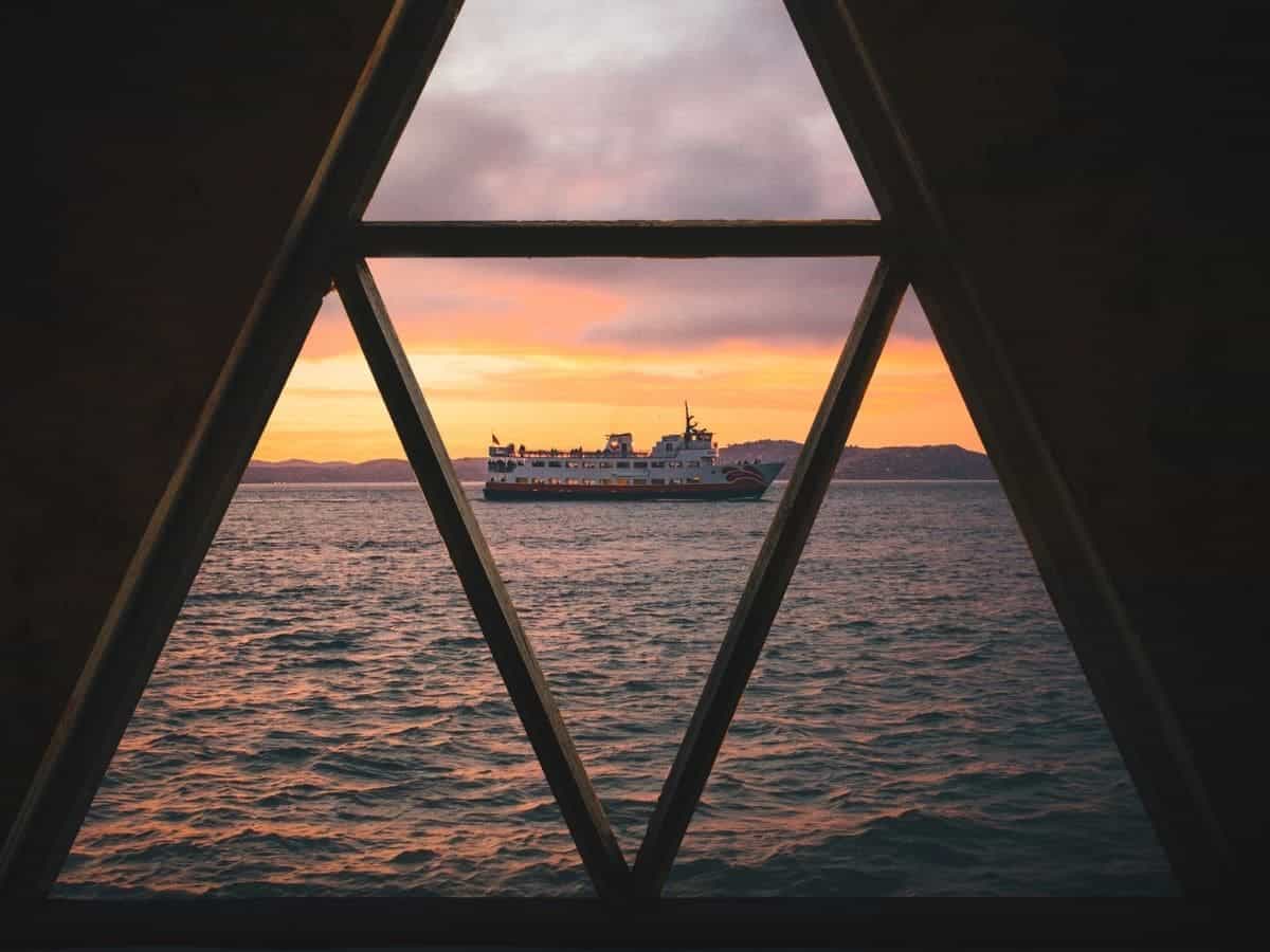 Ship on the water through a window frame.
