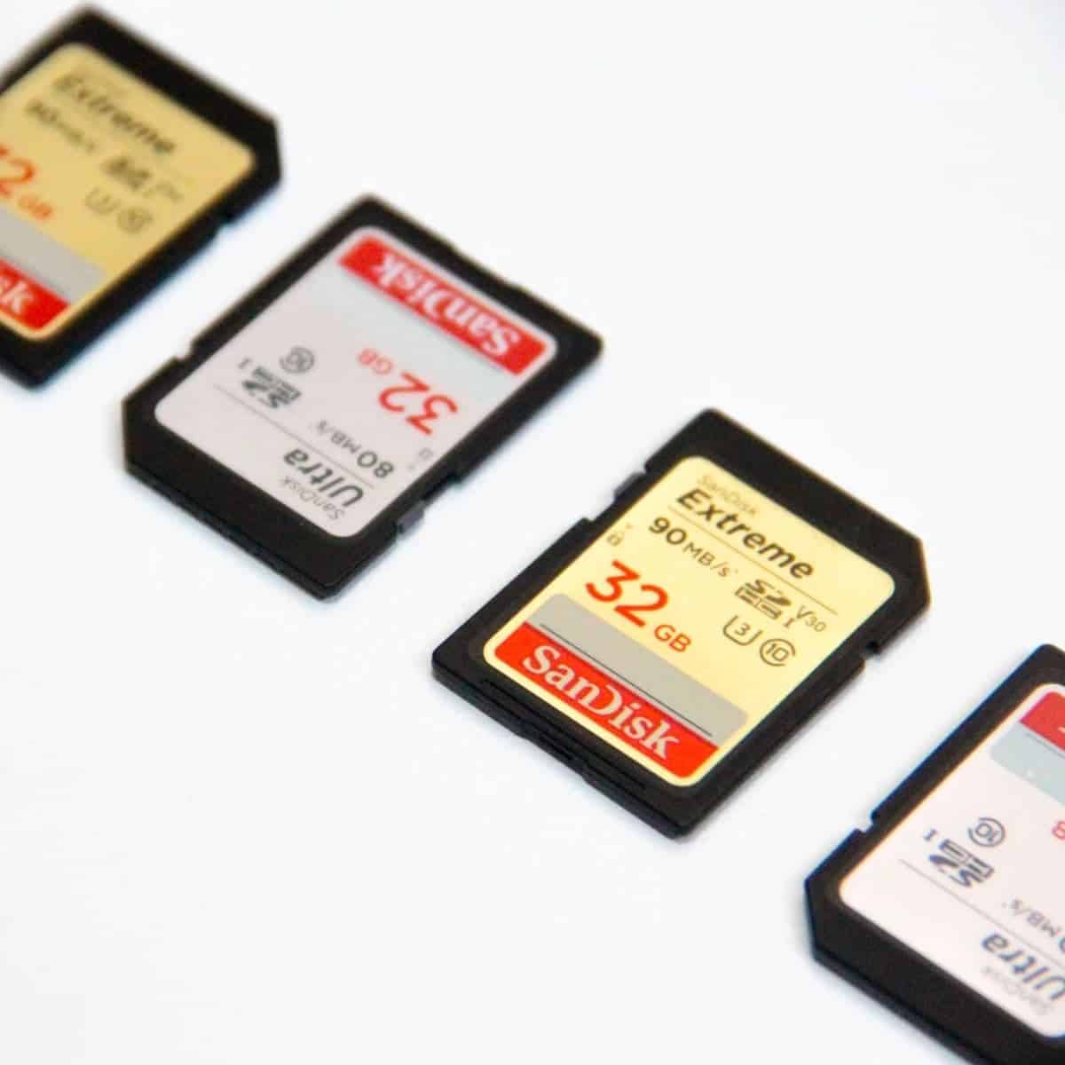 Four memory cards on a table.
