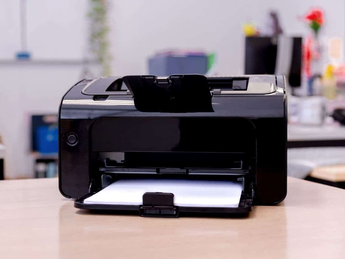 Printer on a table in an office.