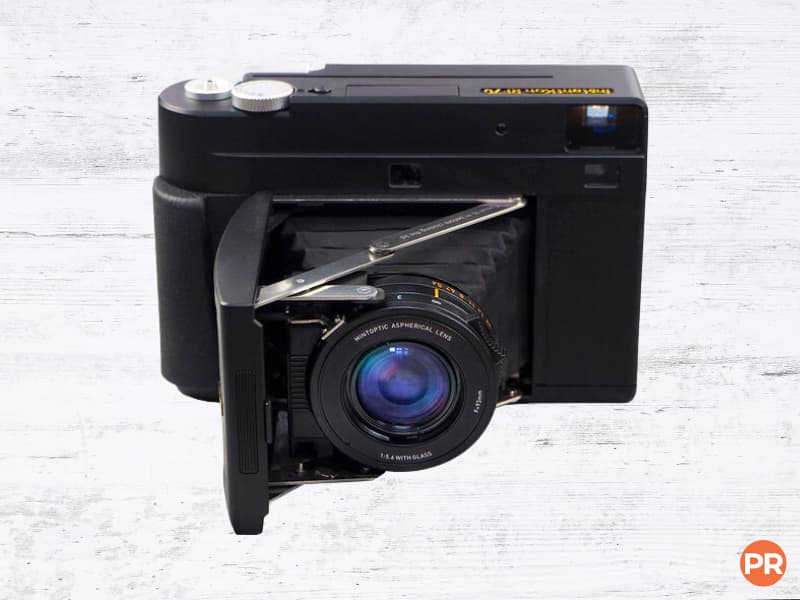 Instant camera with a flip-out lens.