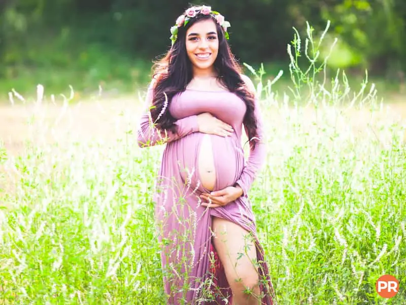 Pregnant woman in a field.