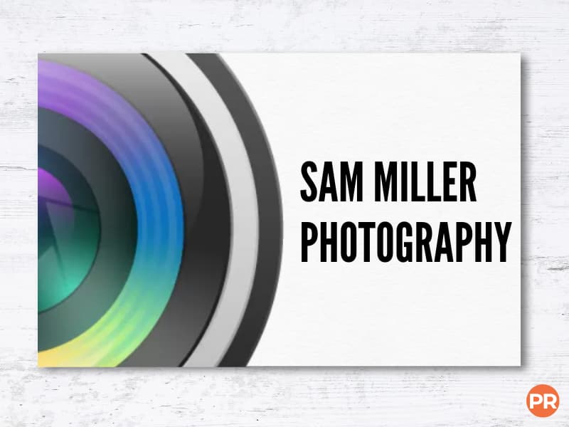 Business card with half of a camera lens.