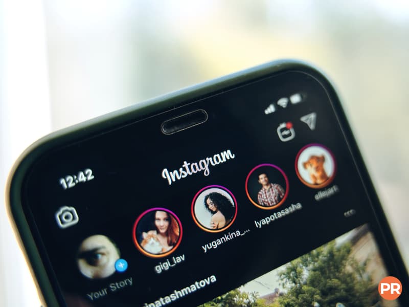 Close-up of a phone showing Instagram Stories.